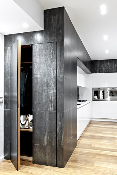 This renovated apartment in Italy by M12 Architettura Design boasts elegant black and white palette and custom cabinets