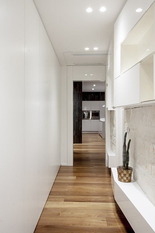 Modern hallway leading to the bedroom in a renovated apartment in Italy