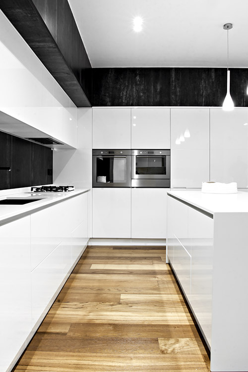 Small black and white kitchen design idea in a renovated apartment located in Italy - SG House by M12 Architettura Design