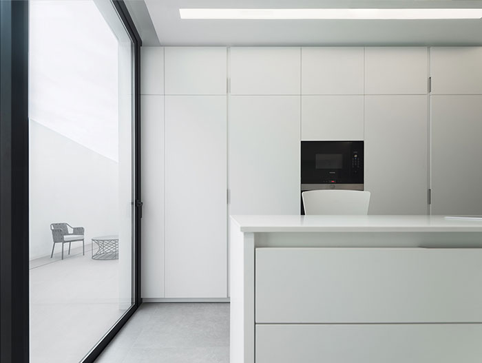 Modern white kitchen design in Spanish house - by Ruben Muedra