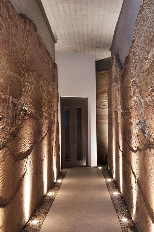 The Books House by Luigi Rosselli Architects in Sydney, Australia - sandstone cut corridor