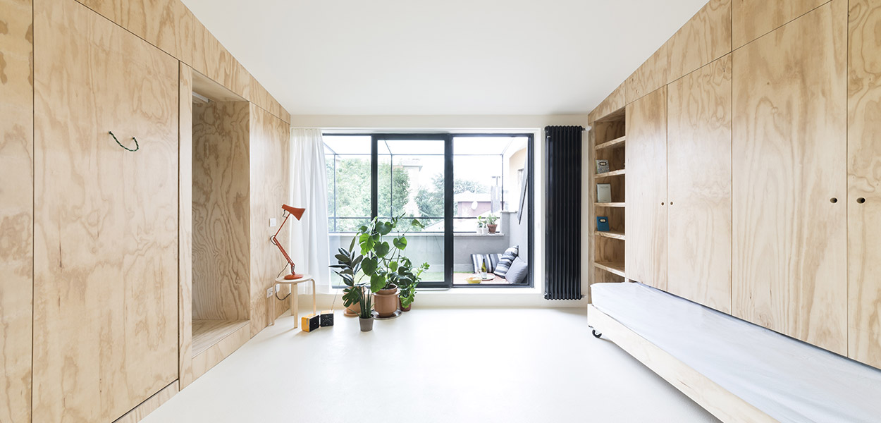 Main living space in small apartment in Milan of only 28 square meters by Studio WOK - with fantastic space saving furniture system