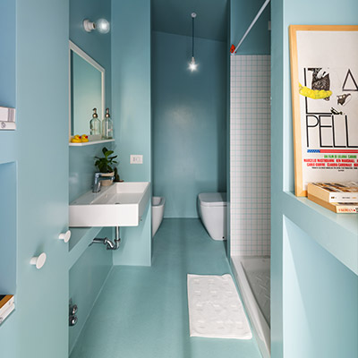 Functional small turquoise blue bathroom in small 28 square meter apartment in Milan, Italy by Studio WOK