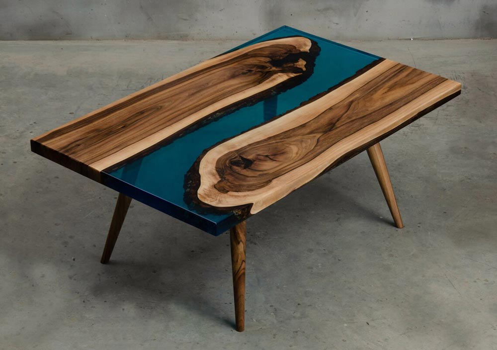 Small epoxy resin table made of walnut wood and blue UV resin for sale perfect for a modern living room