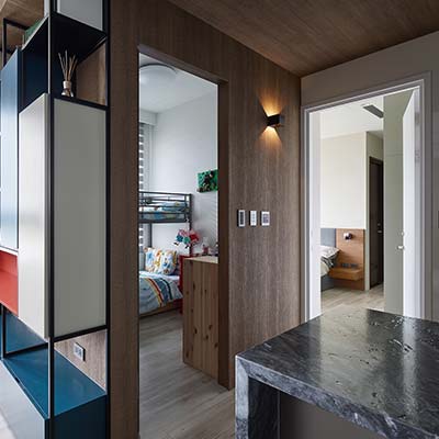 Small hallway leading to the bedrooms inside a small home - design by Awork.Design Studio