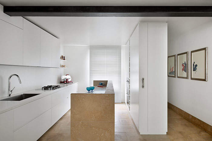 Small white kitchen design idea in a renovated house in London - by extrArchitecture