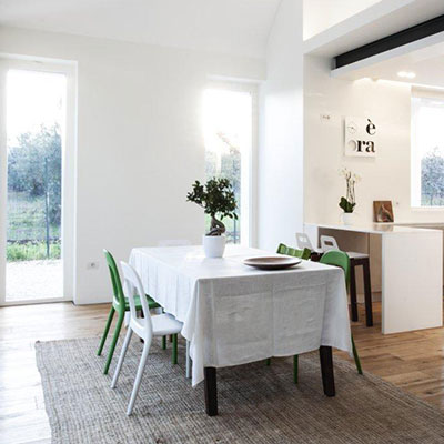 Lovely dining room design idea in a sophisticated home located in Italy, renovated by m12 AD to be in perfect balance with the surrounding environment