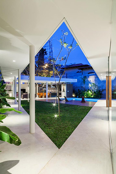 Spectacular house in Sao  Paulo, Brazil  by FGMF Architects - intended as a multigenerational family home where members can reunite, sunbathe near the pool and enjoy this lavish central courtyard