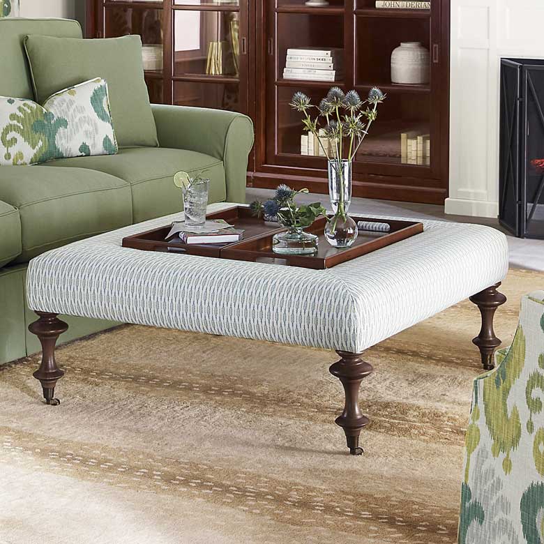 Square ottoman with two birch wood trays, perfect for entertaining guests