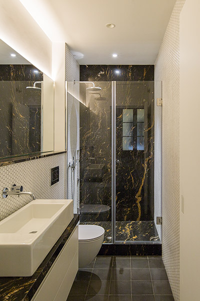 Modern bathroom design idea in a stunning apartment in Barcelona - House of Mirrors by Nook Architects