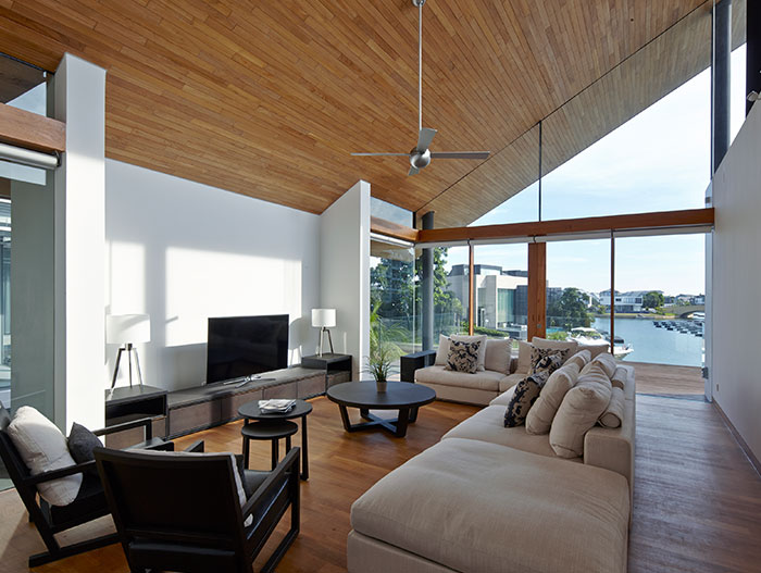 Stunning living room design in sophisticated Singapore home for a family living by the sea