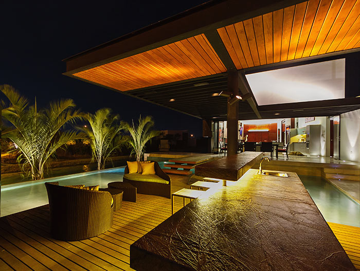 Stunning modern lakeside house terrace at night