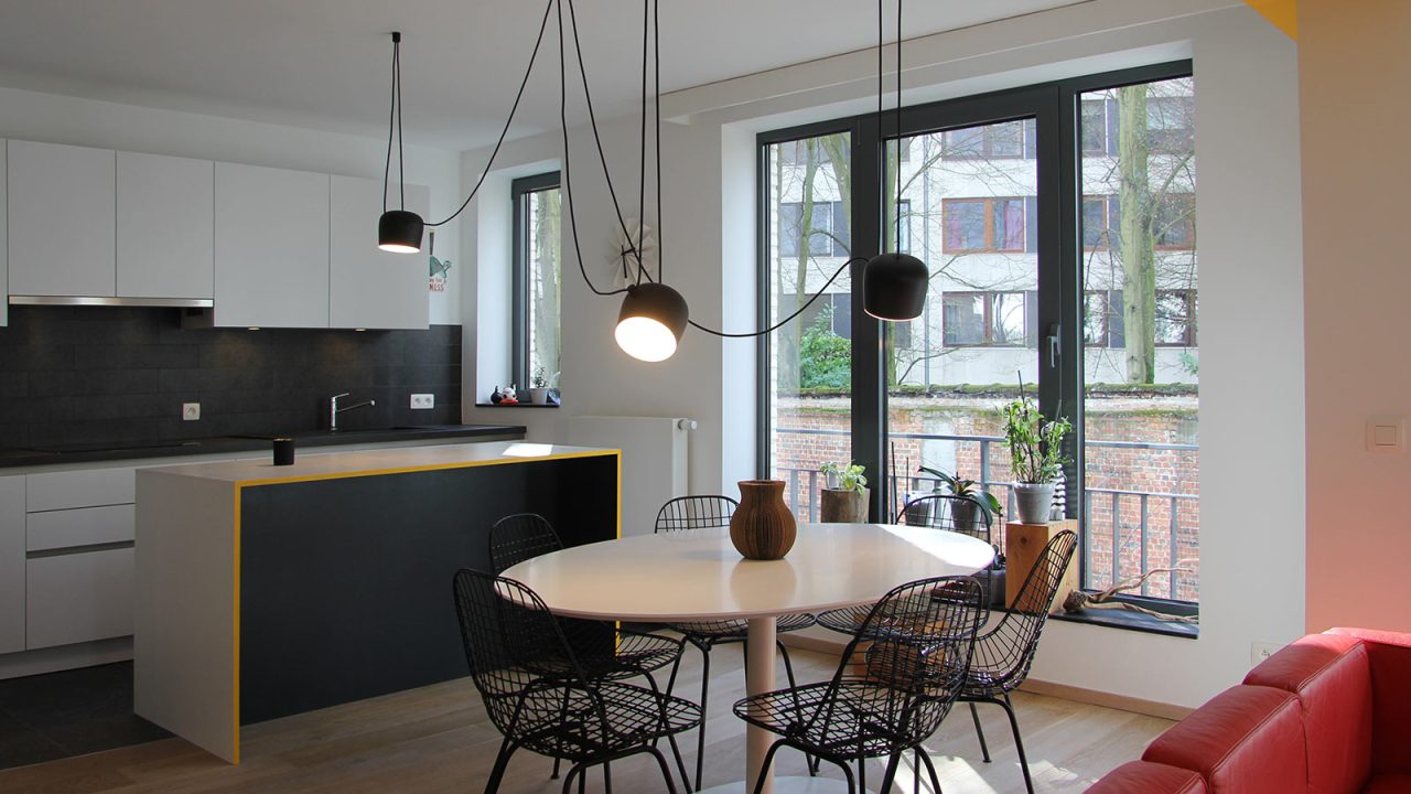 This apartment in Brussels uses cleverly designed furniture to maximize storage space