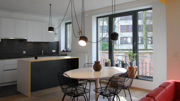 This apartment in Brussels uses cleverly designed furniture to maximize storage space