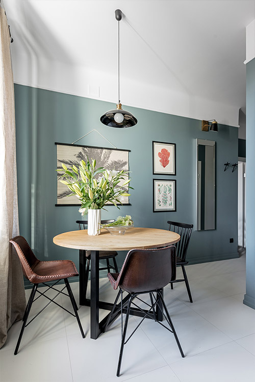 Stylish dining area inside small apartment in Poland