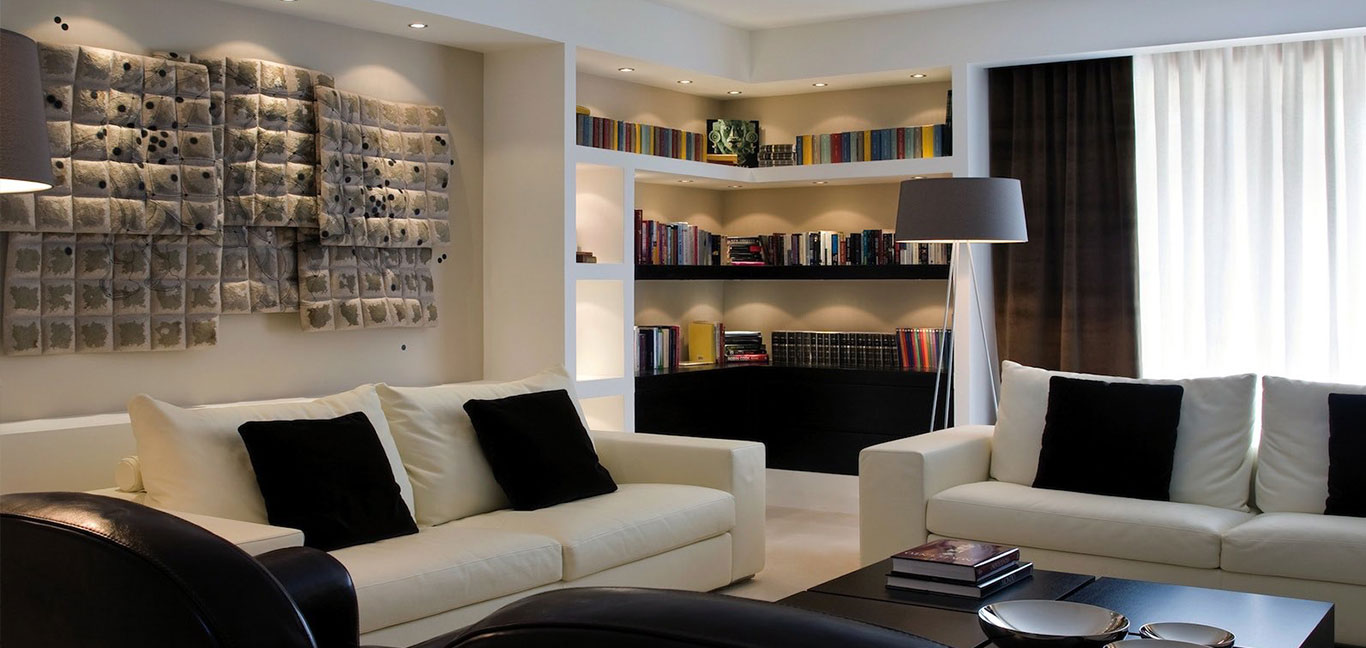 Stylish living room with modern Italian furniture in remodeled duplex apartment - white and beige color palette - designed by Ernesto Fusco