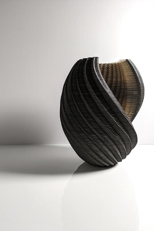 Laser-cut paper vessel by Ibbini Studio