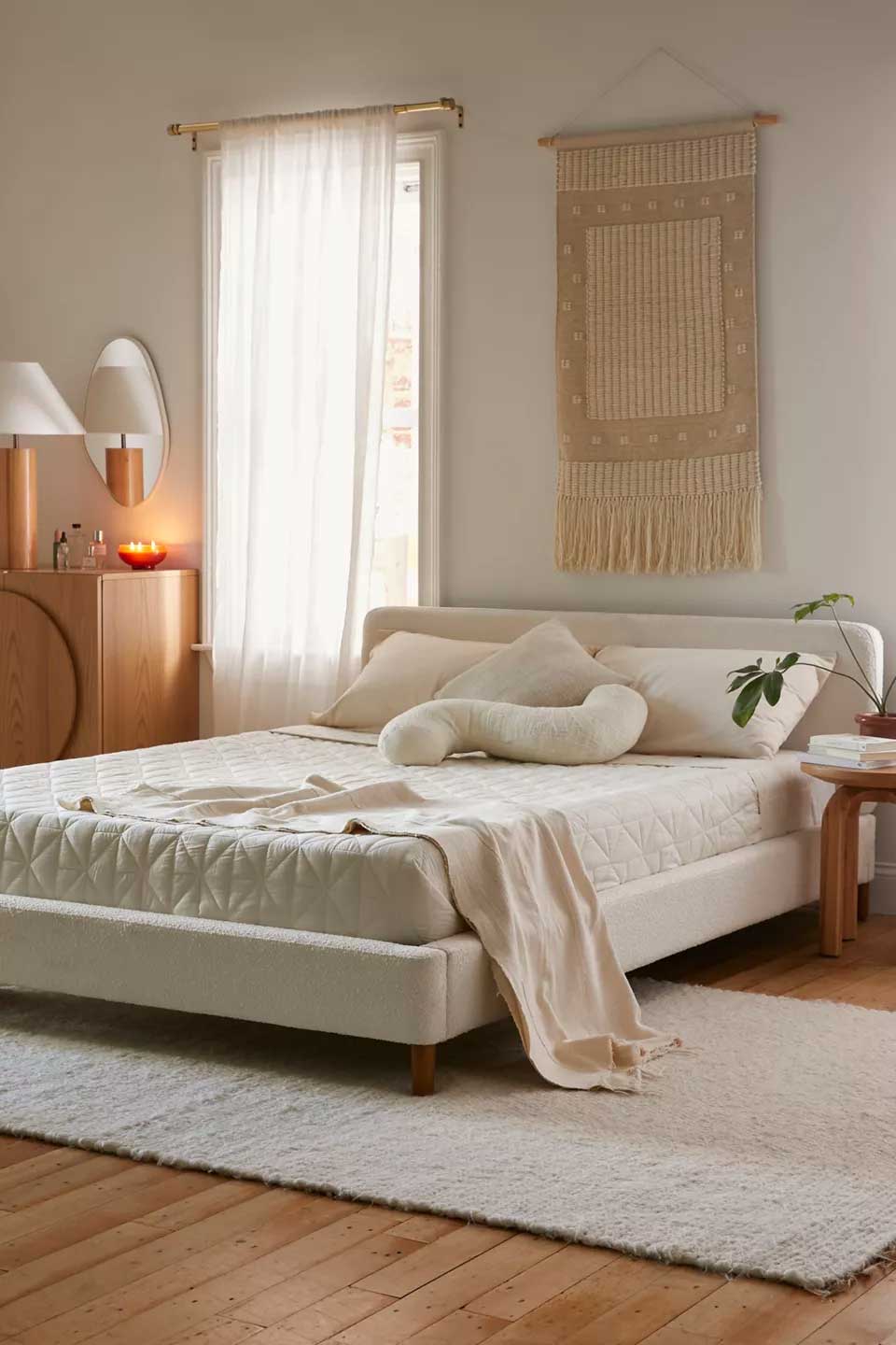 Upholstered platform boucle bed for a modern bedroom