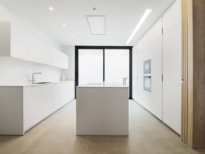 Modern white kitchen design in Spanish house