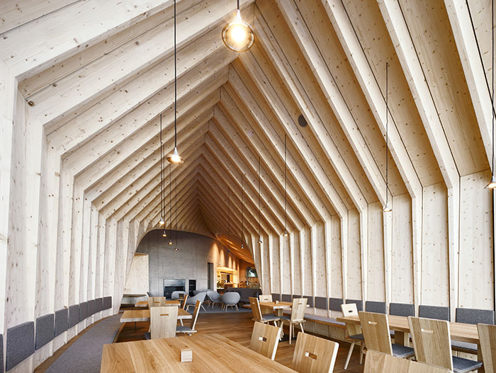 This wooden restaurant located in the Italian Alps offers great food and stunning mountain views